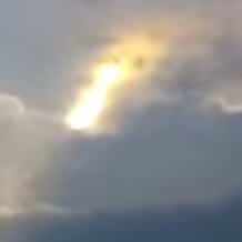 UFO or HAARP created light in the clouds